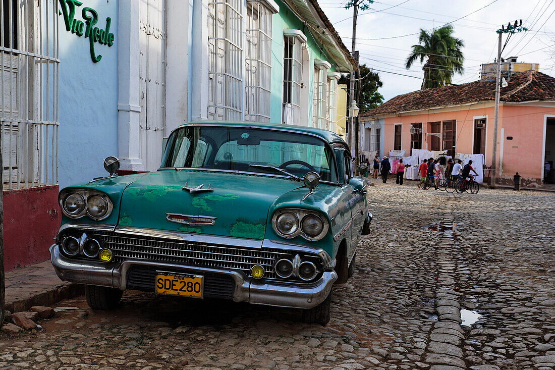 Vintage car near restaurant, Trinidad, Sancti Spiritus, Cuba, West Indies