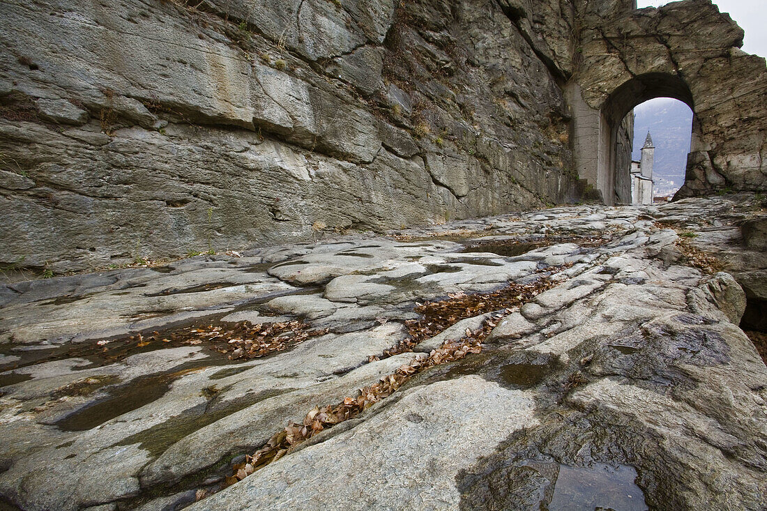 Roman consular road and arch,  dug into live rock. Donnas,  Aosta Valley,  Italy