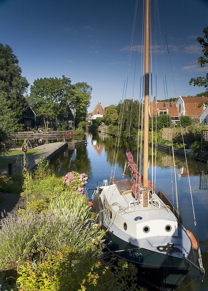 Canal with sailboat in Edam, Holland, Netherlands, Europe