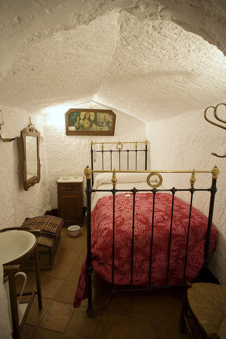 Bedroom, home interior in the troglodytic neighbourhood, Guadix. Granada province, Andalucia, Spain