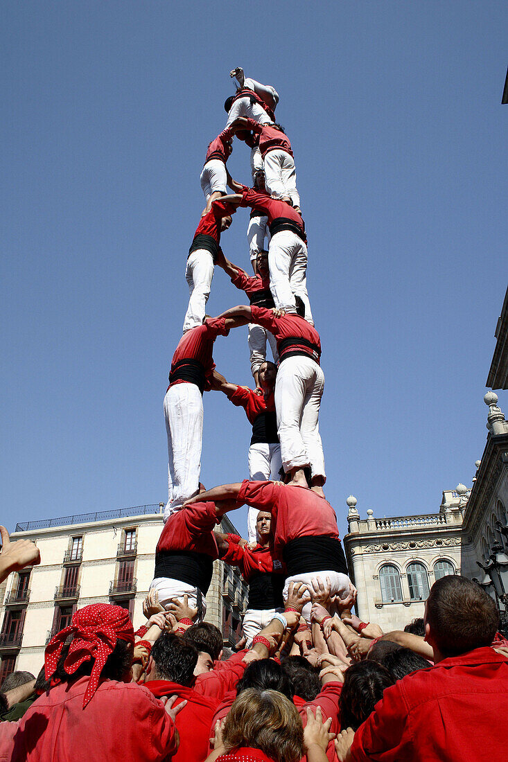 Castellers human towers builders in Plaça de Sant Jaume, La Merce festival, Barcelona. Catalonia, Spain