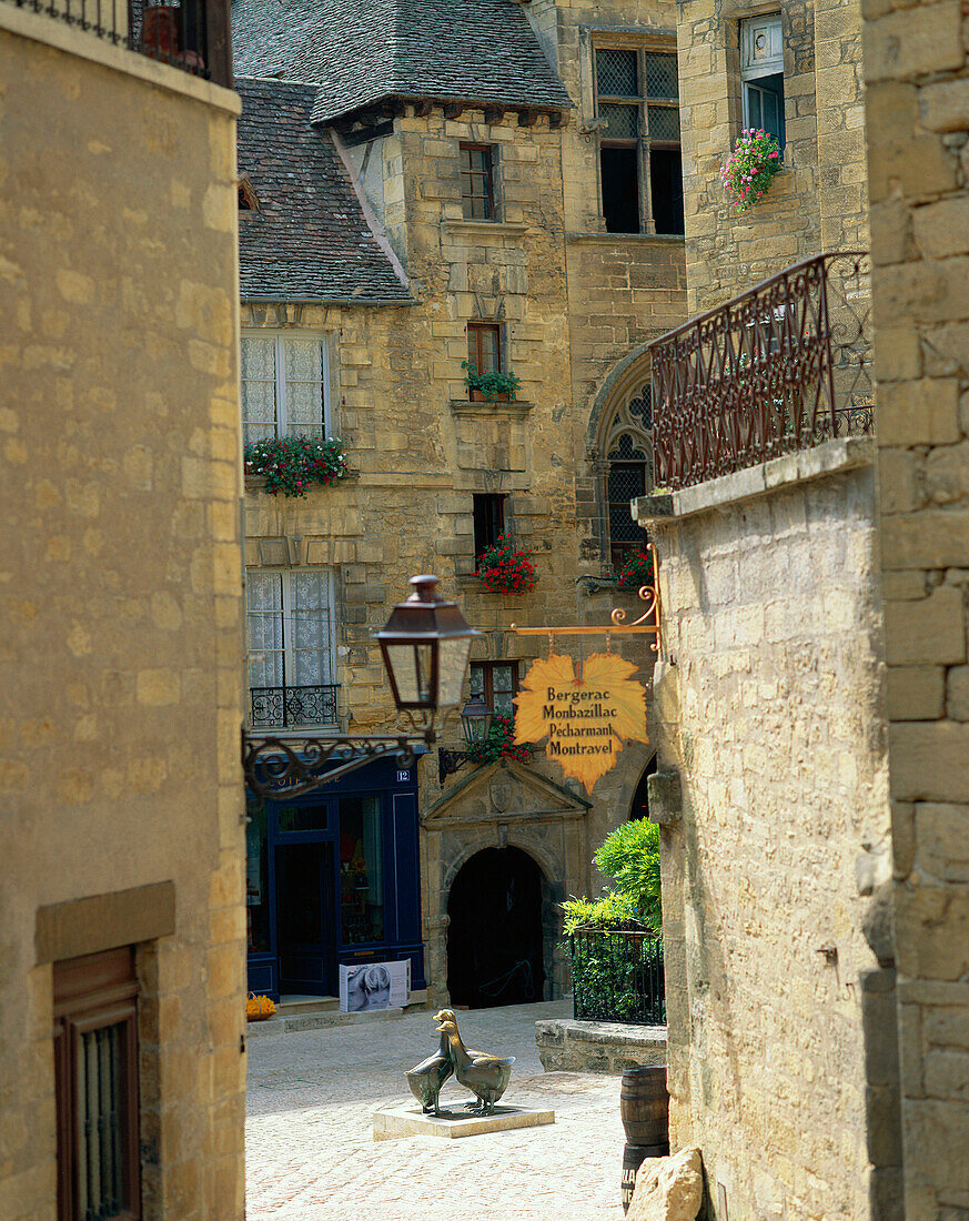 Tall houses surrounding small square, Sarlat, The Dordogne, France