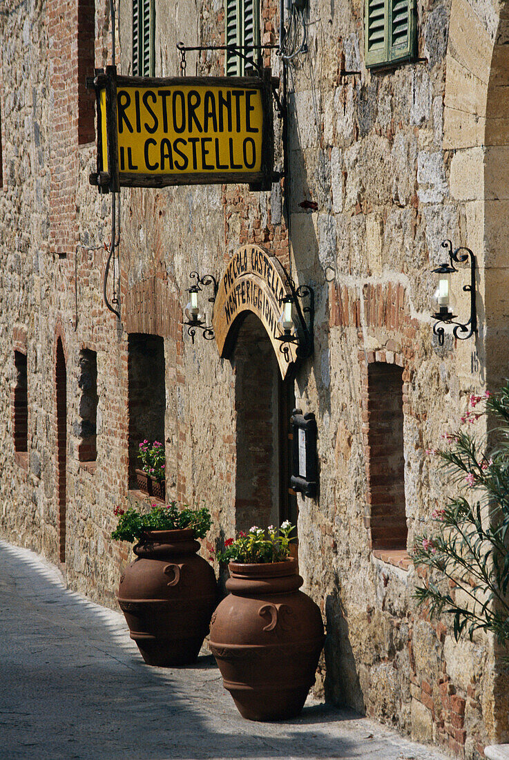Restaurant entrance in village square, Monteriggioni, Tuscany, Italy