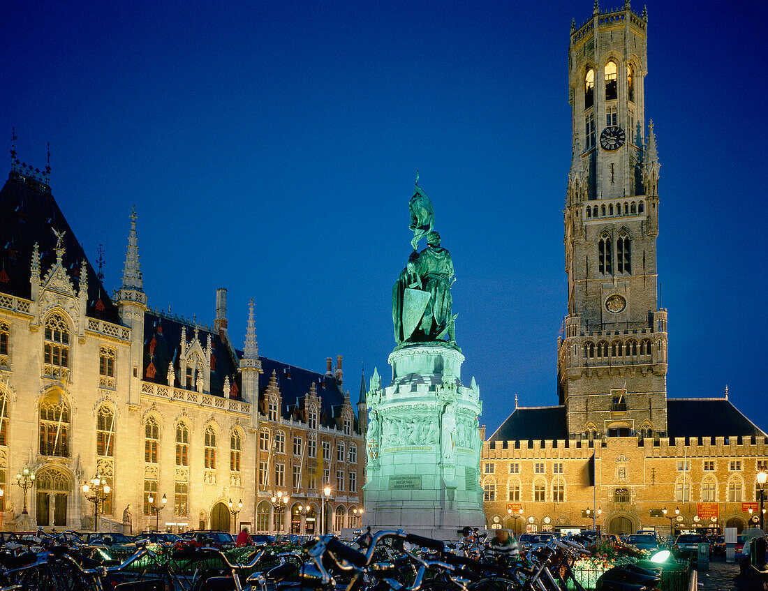 The Grote Market at night with floodlit statue, Bruges, Flanders, Belgium