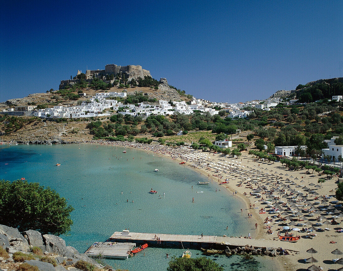 View of beach and town, Lindos, Rhodes Island, Greek Islands