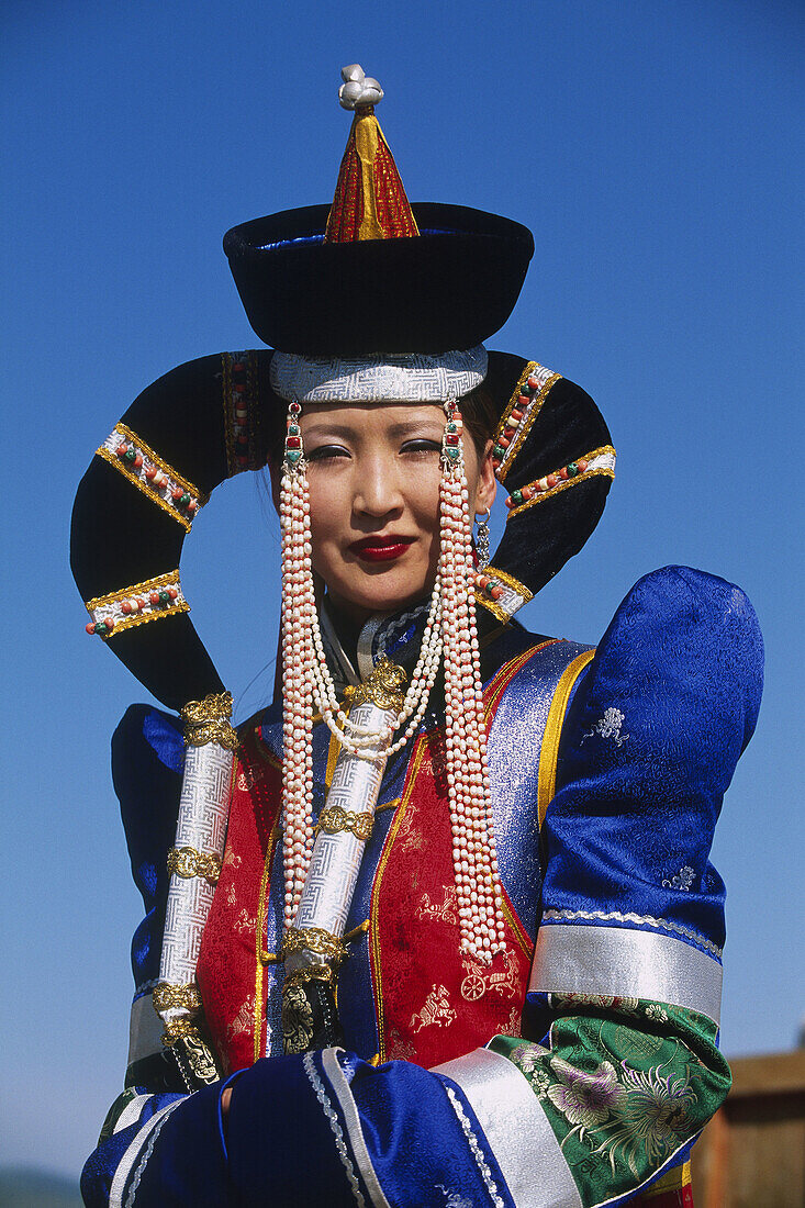 Woman wearing the traditional crows wings head-dress. Maidar festival. Kharkhorin. Mongolia