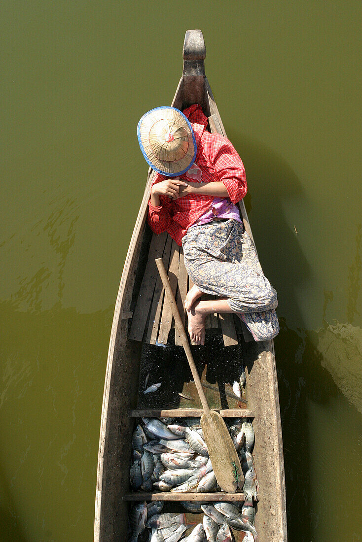 FISHERMAN ASLEEP IN BOAT, GENERAL, PEOPLE, BURMA