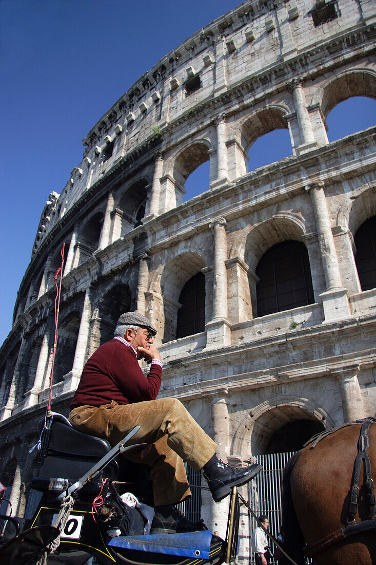 Colosseum & carriage driver, Rome, Lazio, Italy