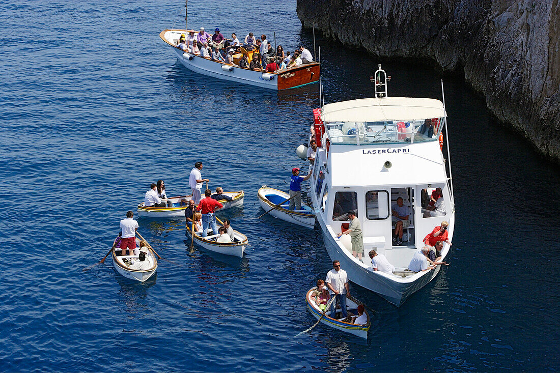 People in boats off the rocky coast, Capri, Italy, Europe