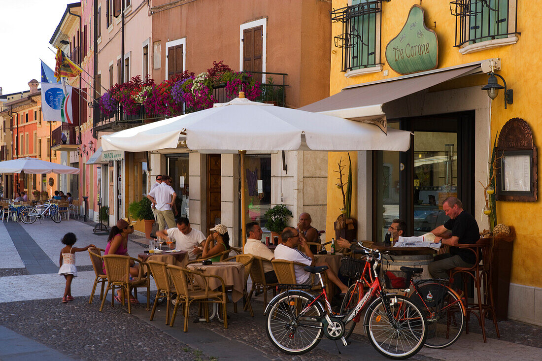 People in a cafe, Market square in Valeggio sul Mincio, Verona province, Veneto, Italy