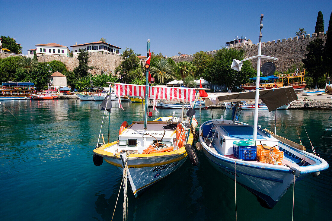 Boats, harbour and city wall under blue sky, Antalya, Turkey, Europe