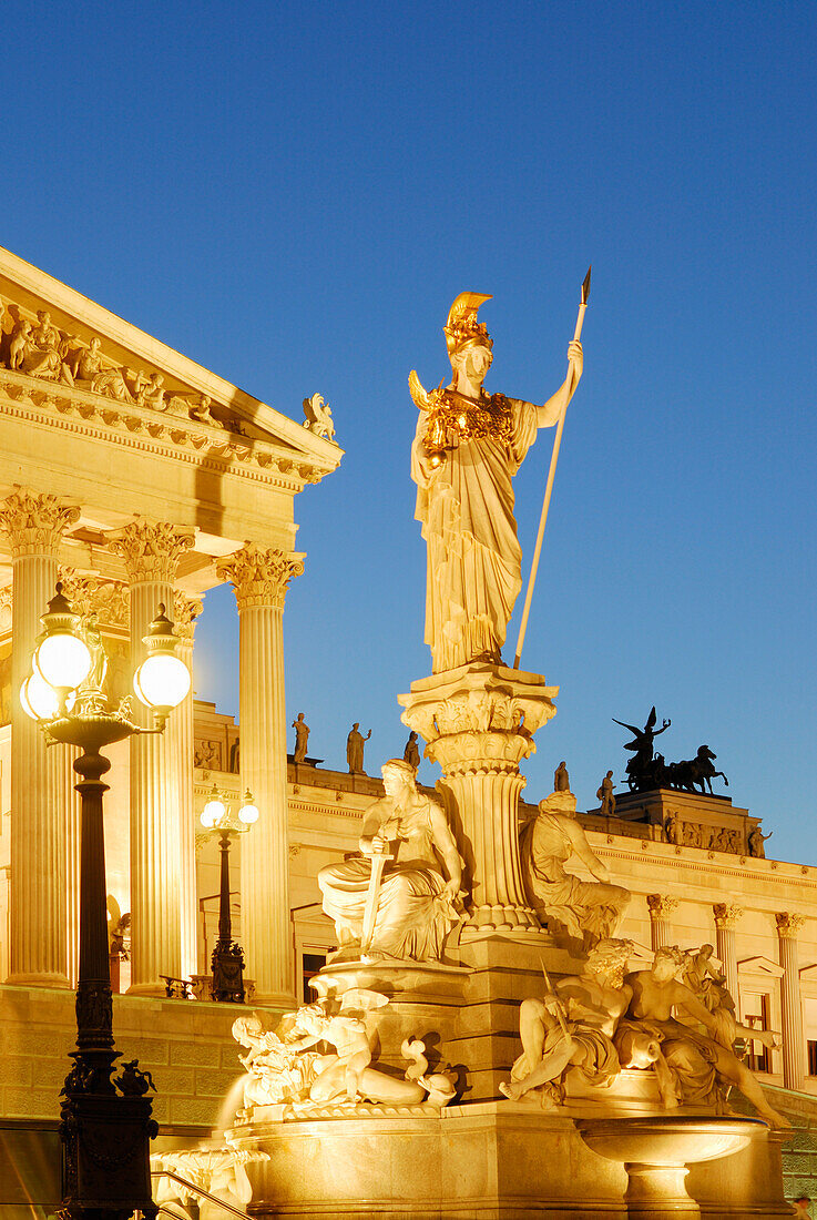 Pallas-Athena fountain in front of parliament in the evening, Vienna, Austria