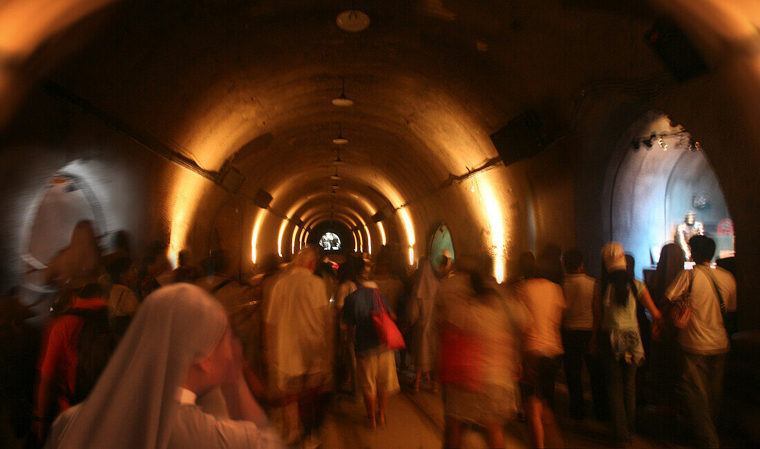 Tourists walking through the Malinta Tunnel, Corregidor Island, Manila Bay, Philippines, Asia