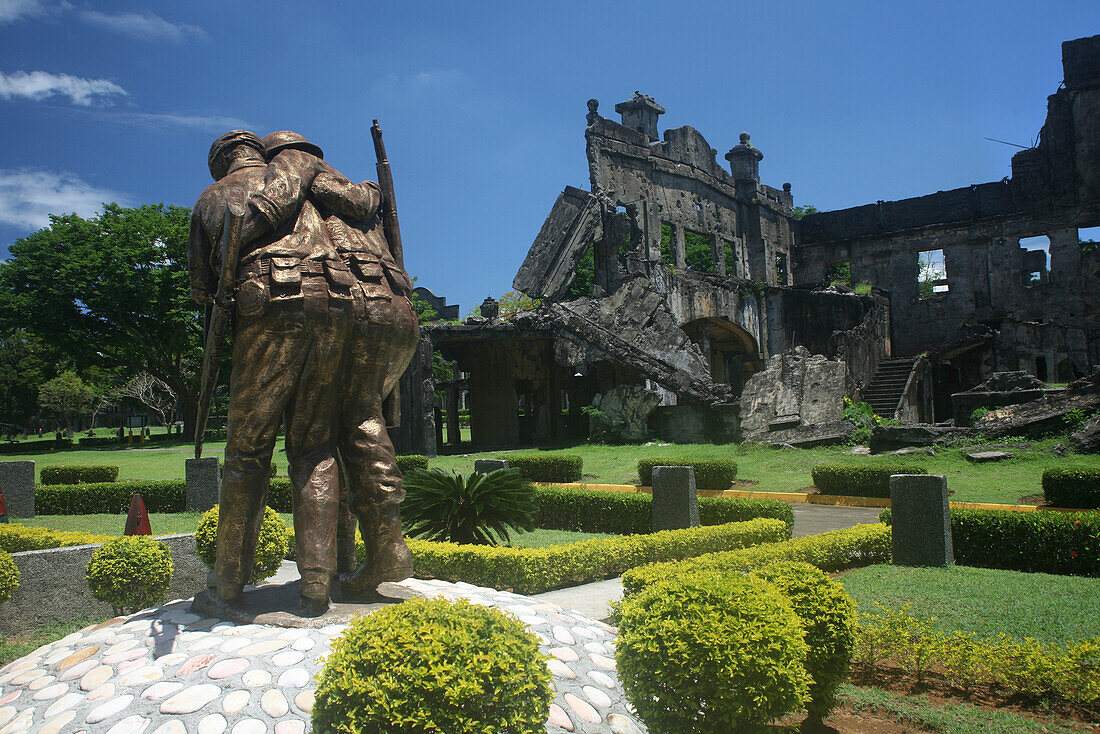 War memorial in front of the ruins of a theater, Corregidor Island, Manila Bay, Philippines, Asia