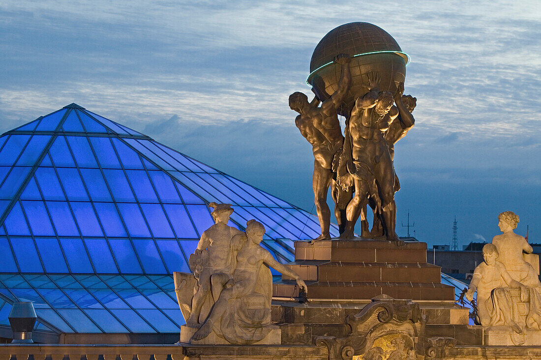 atlas figures holding globe, Museum for Communication at night, Berlin