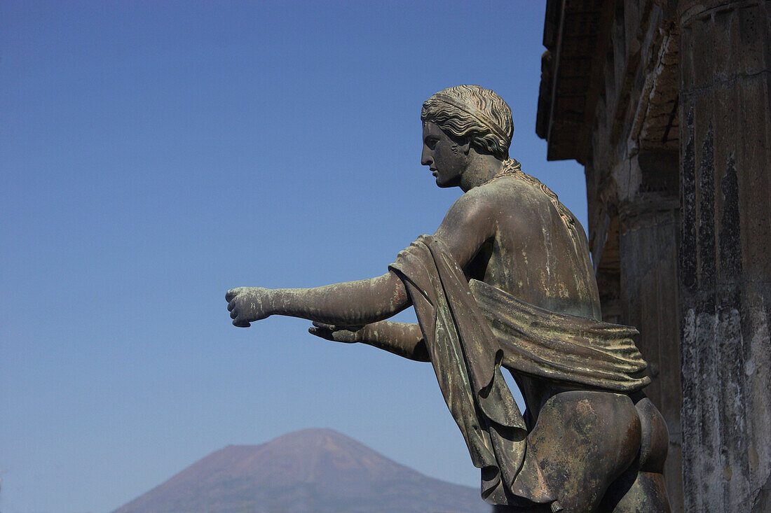 Temple of Apollo with statue and Mount Vesuvius, Pompeii, Campania, Italy