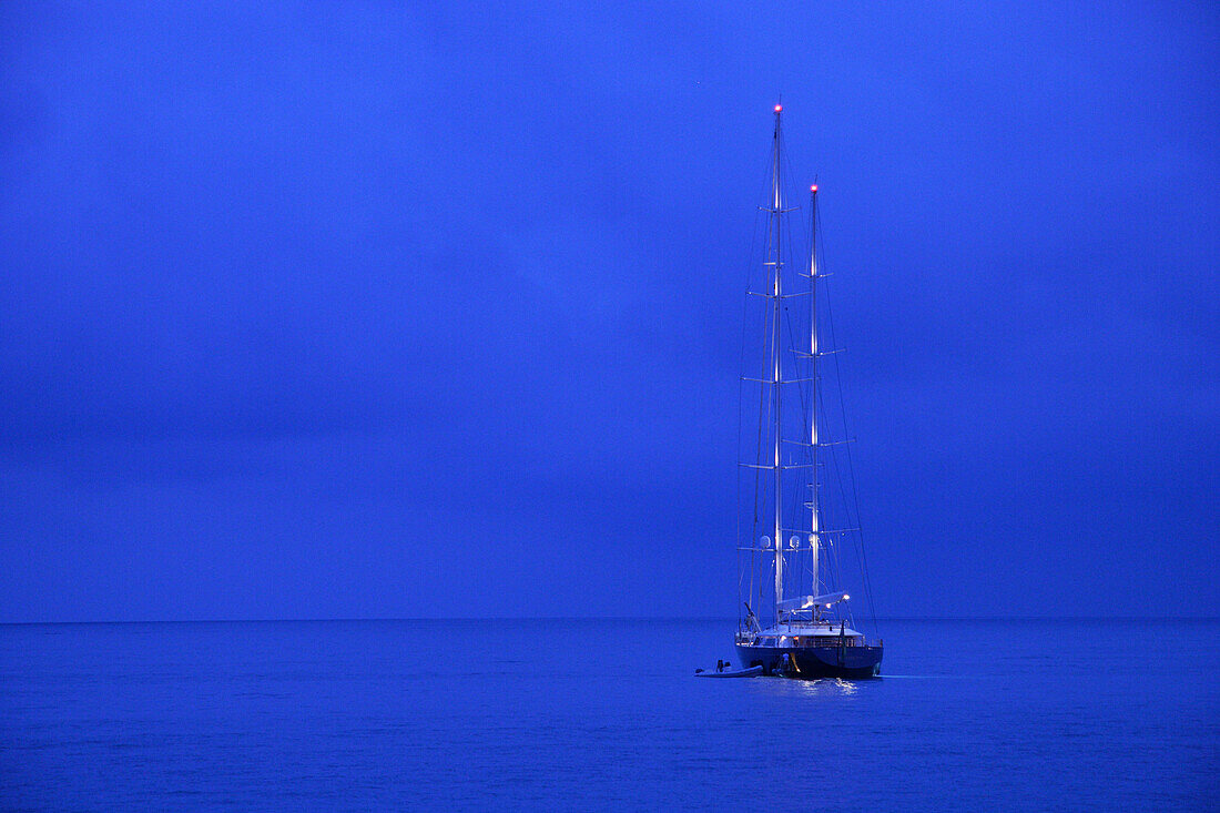 Yacht on water at night, Antibes, Cote d'Azur, France