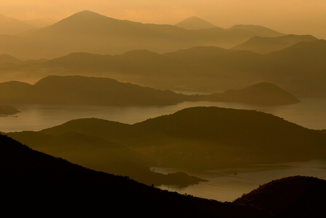 Misty view over Sai Kung at sunrise, Sai Kung Peninsula, Hong Kong, China