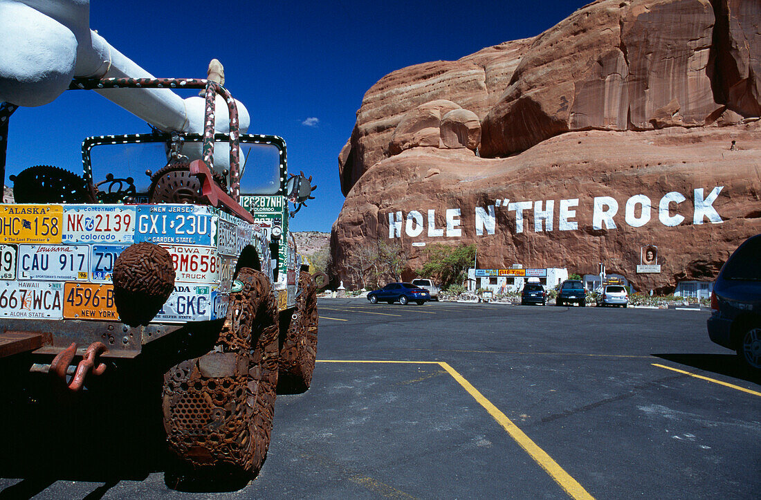 Hole N The Rock sign on mountain and truck, Moab, near, Utah, USA