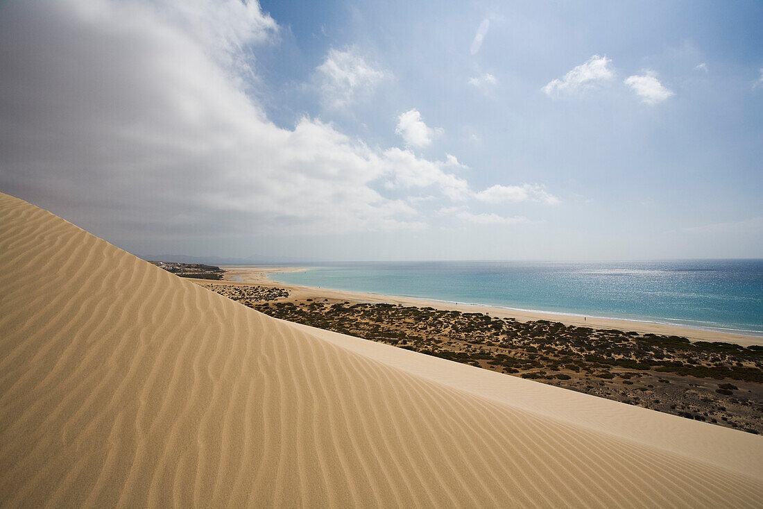 Dune on the waterfront in the sunlight, Playa de Satovento de Jandia, Parque Natural de Jandia, Jandia peninsula, Fuerteventura, Canary Islands, Spain, Europe