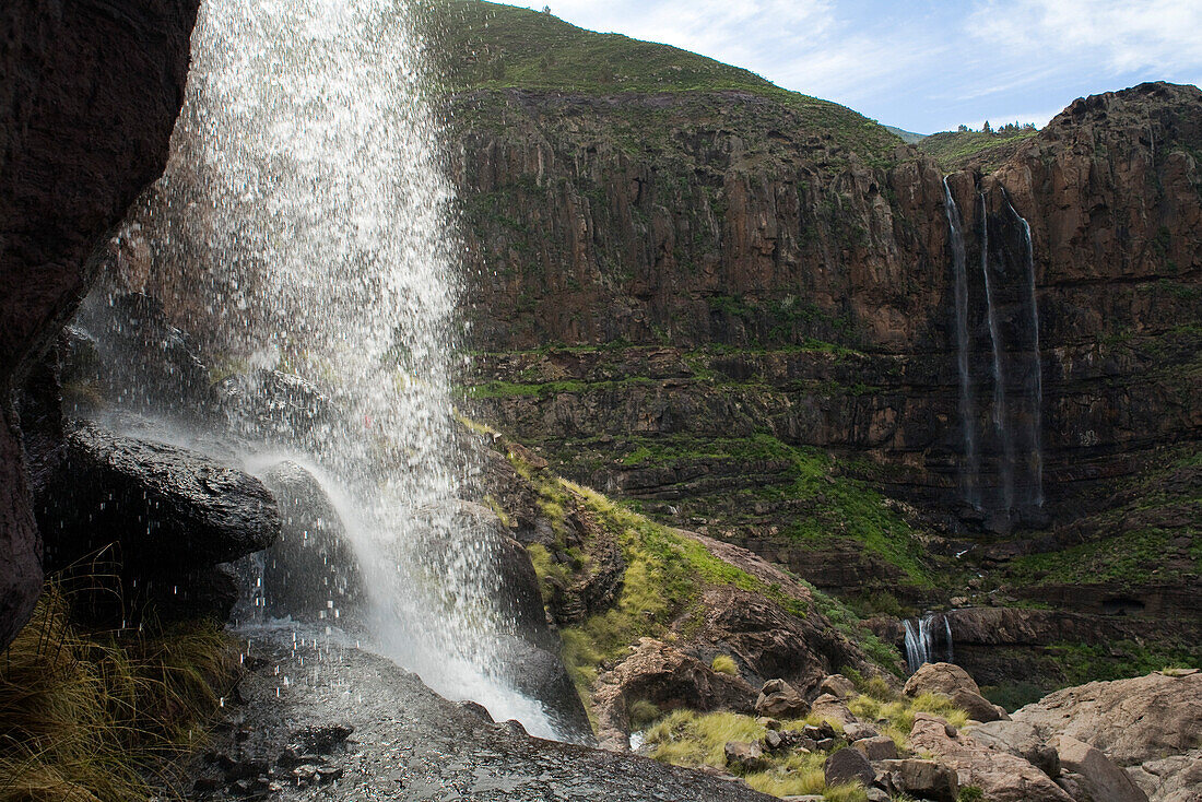 Waterfall Cascada El Palmar in the sunlight, Cascada El Escobar in the background, Valley of El Risco, Parque Natural de Tamadaba, Gran Canaria, Canary Islands, Spain, Europe