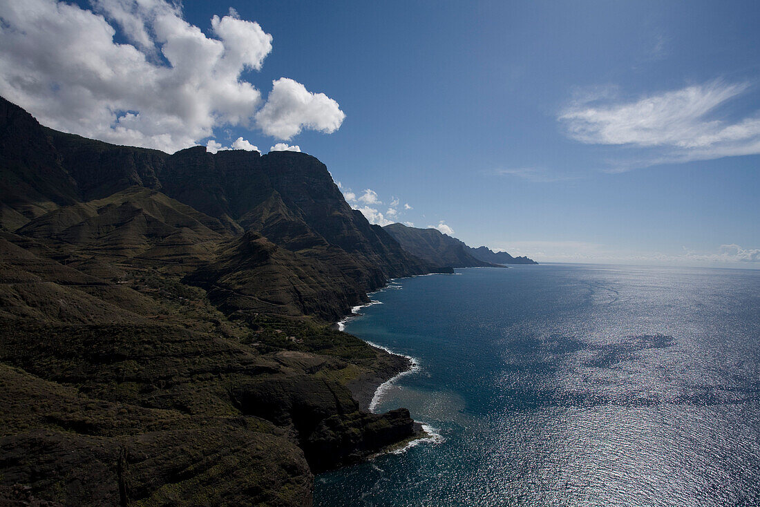 View at steep coast and Guayedra beach in the sunlight, Parque Natural de Tamadaba, Gran Canaria, Canary Islands, Spain, Europe