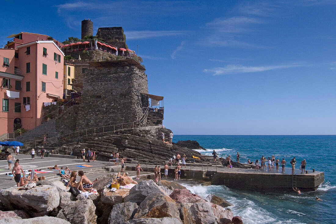 People bathers at the mole, Vernazza, Cinque Terre, Liguria, Italian Riviera, Italy, Europe