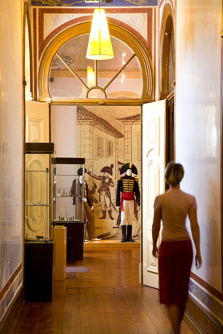 Young women walking down a corridor in the ethnographic museum, Museu Etnografico do Trajo Algarvio, Sao Bras de Alportel,  Algarve, Portugal