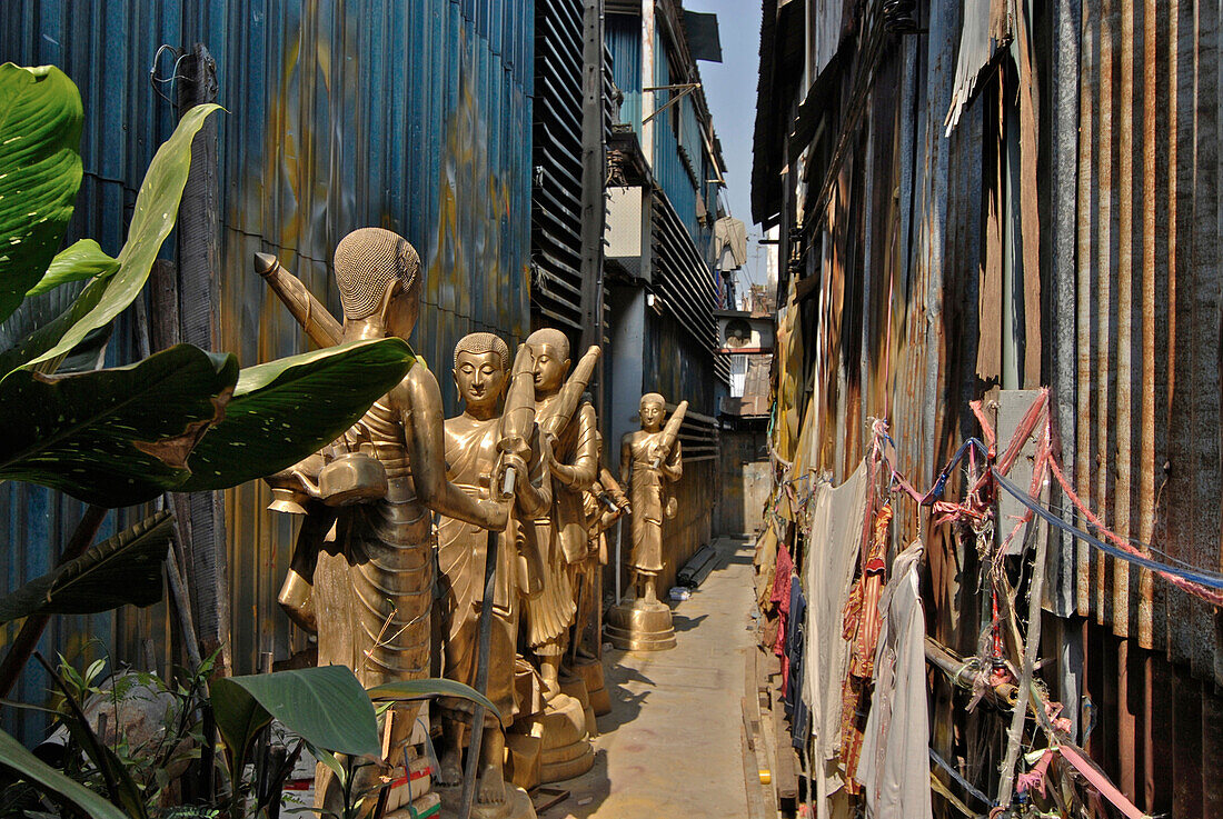 Devotional Shops, monk statues standing on the pavement, Old Town, Bamrung Muang, Bangkok, Thailand, Asia