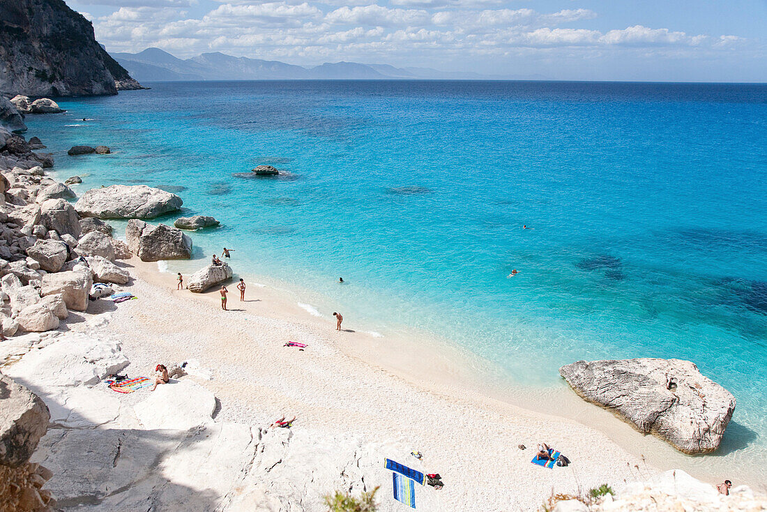 View at people on a sandy beach in the sunlight, Punta Goloritzé, Golfo di Orosei, Sardinia, Italy, Europe