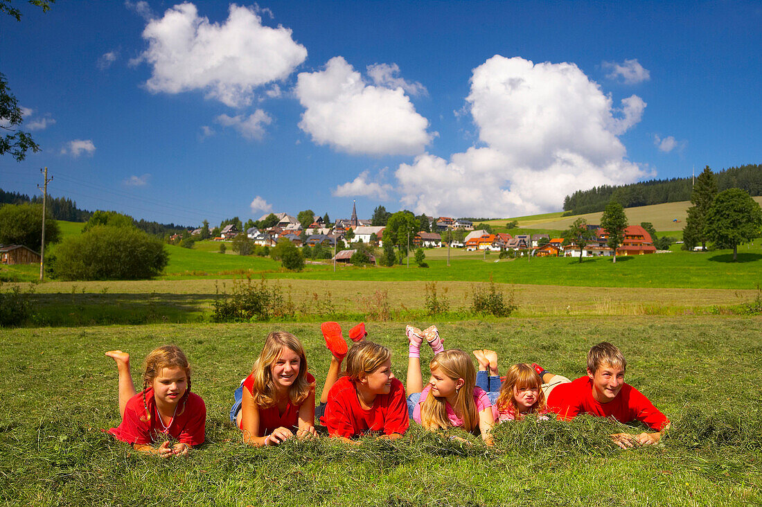 Children playing on a meadow at Titisee-Neustadt, District Waldau, Black Forest, Baden-Württemberg, Germany, Europe