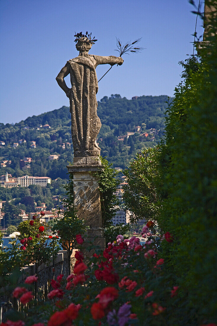 View to ornate statue from gardens, Isola Bella, Lombardy, Lake Maggiore, Italy