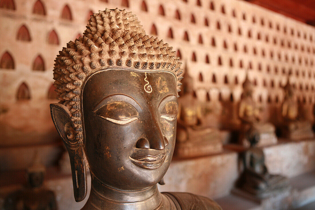 Close up of bronze Buddha statue at Wat Si Saket, Vientiane, Laos