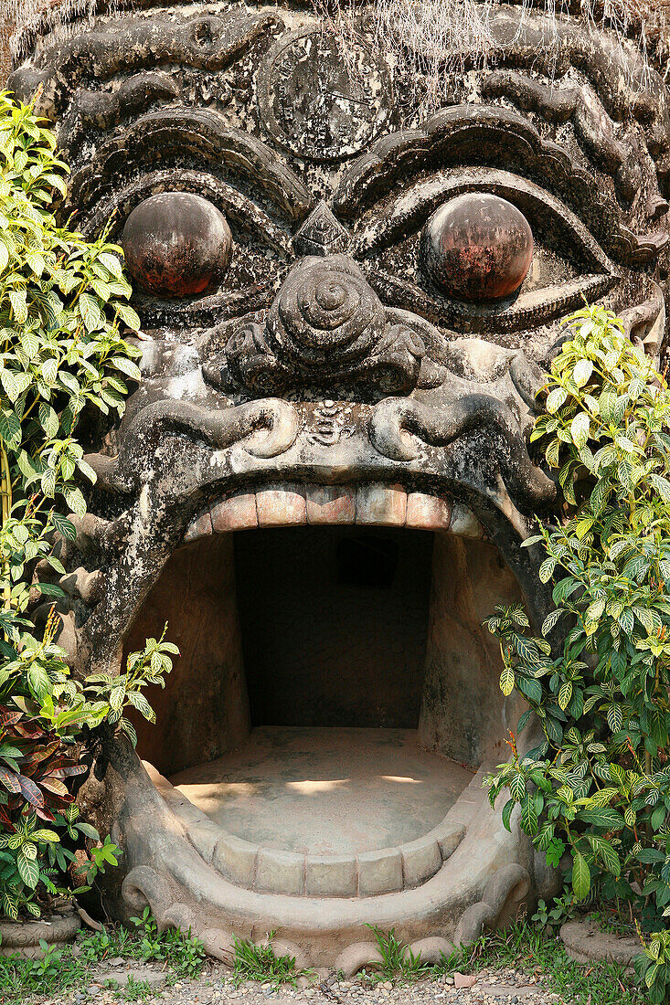 Statue and entrance to main monument at Xieng Khuan, Buddha Park, Vientiane, near, Laos