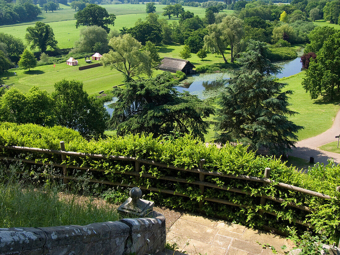 Warwick Castle, view to River Avon and boathouse from The Mound, Warwick, Warwickshire, UK, England