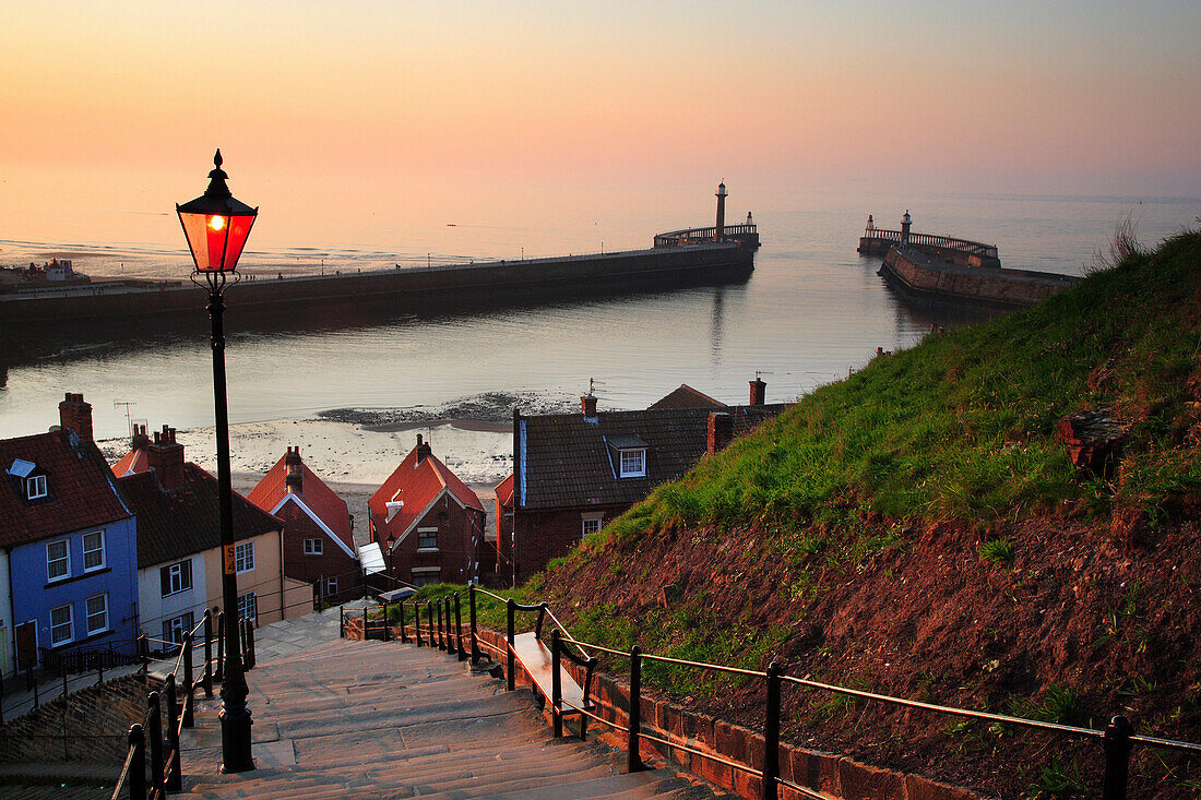 View of 199 Abbey Steps above Whitby Harbour at dusk, Whitby, Yorkshire, UK, England