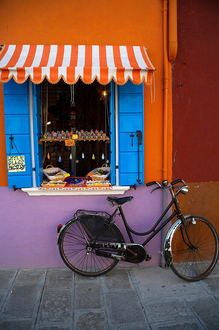 Bicycle and shop window on Burano Island in the Venice Lagoon, Venice, Burano, Veneto, Italy