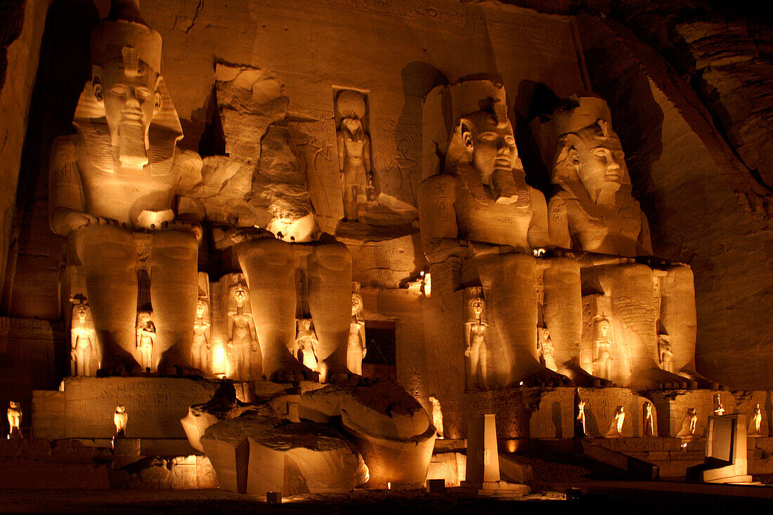 Floodlit statues in Temple of Ramses II at night, Abu Simbel, Egypt