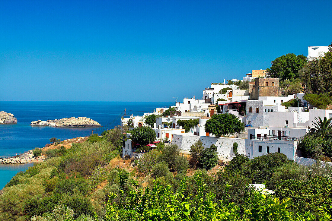 Lindos town on hillside with view over sea, Lindos, Rhodes Island, Greek Islands