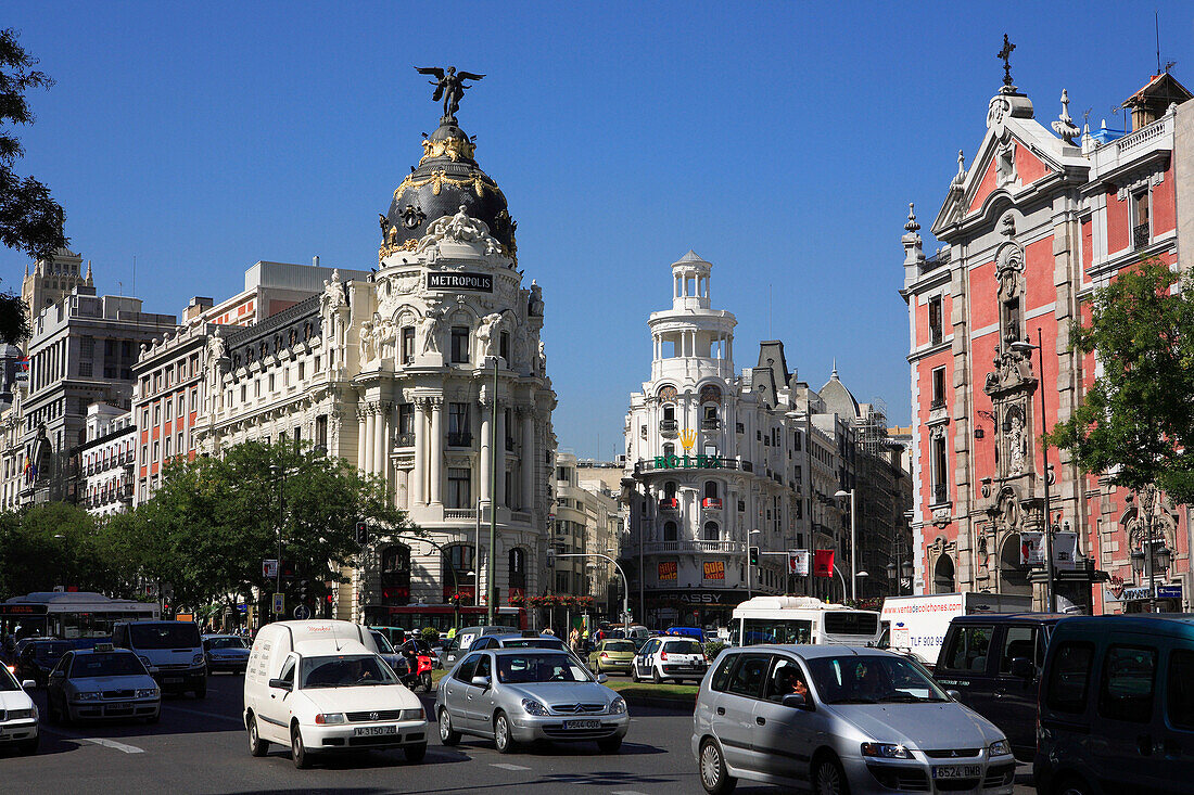 Gran Via, traffic and Metropolis building, Madrid, Spain