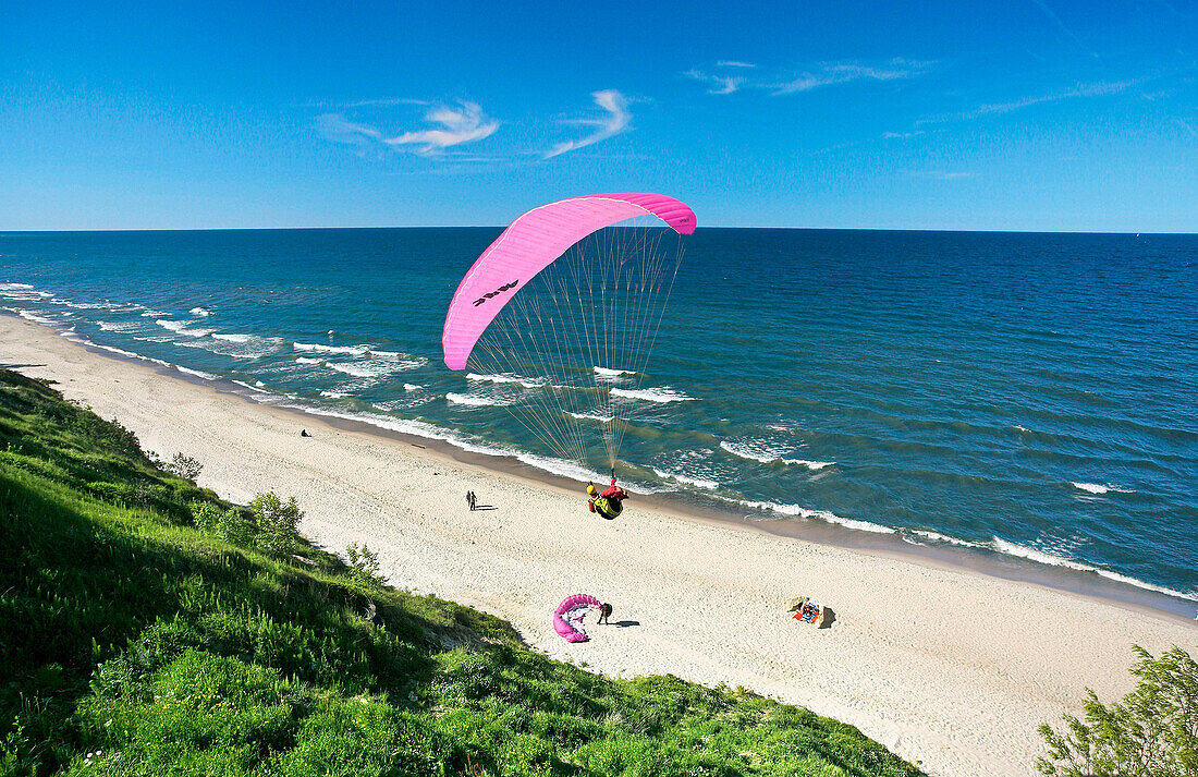Beach scene with paraglider, Gdansk, near, Poland