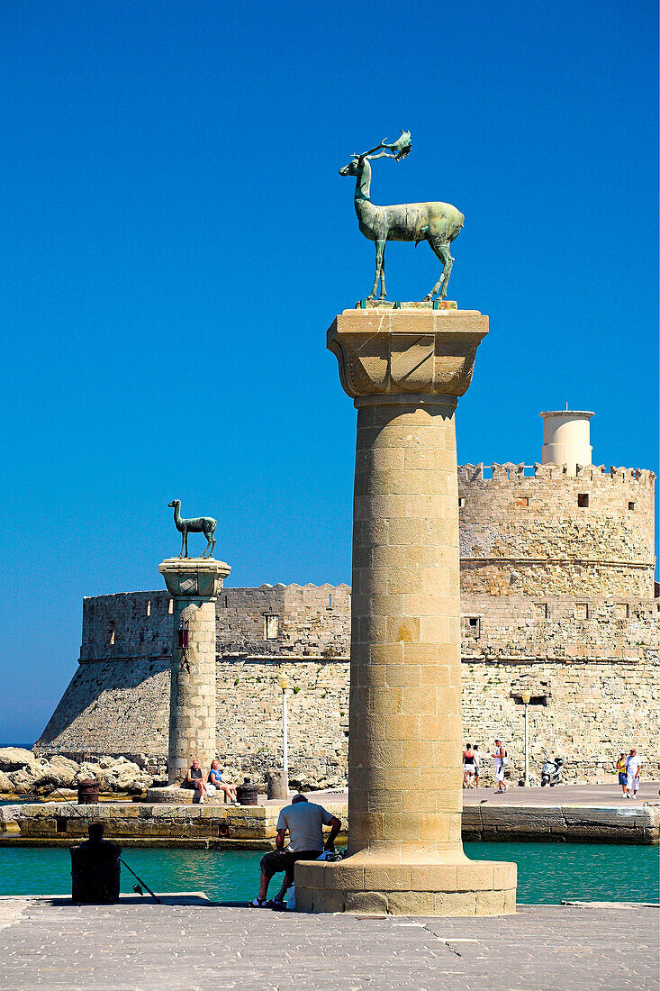 Mandraki Harbour with deer statues and St Nicholas Fort, Rhodes Town, Rhodes Island, Greek Islands