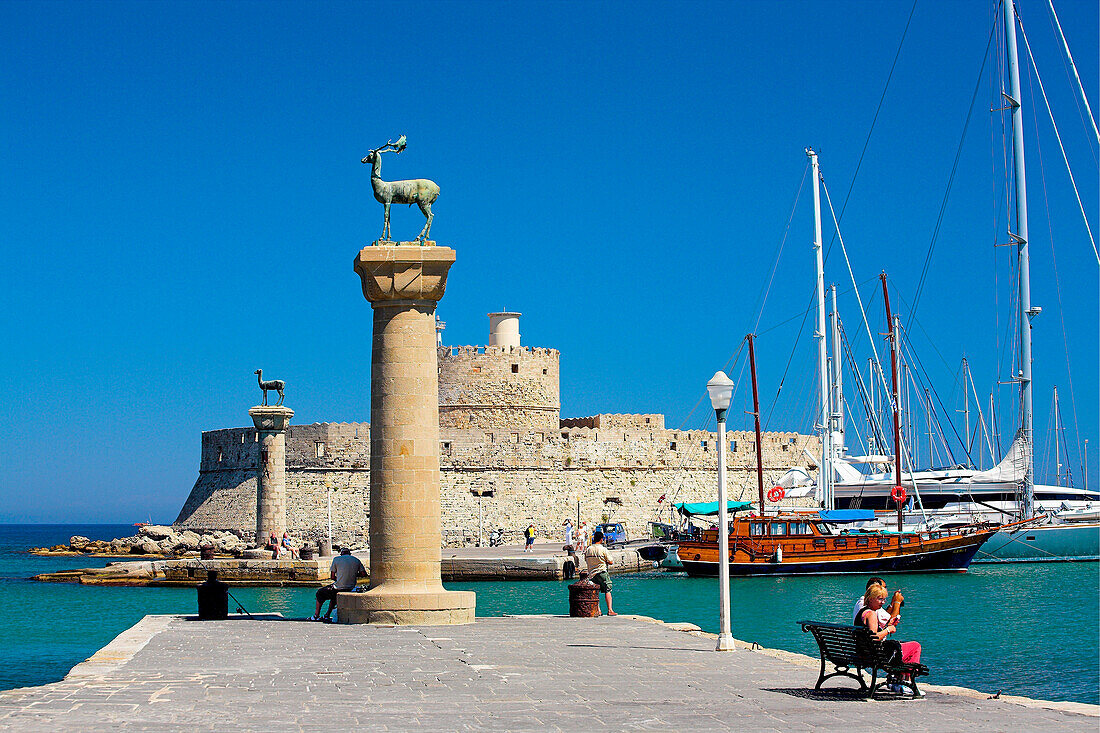 Mandraki Harbour with deer statues and St Nicholas Fort, Rhodes Town, Rhodes Island, Greek Islands