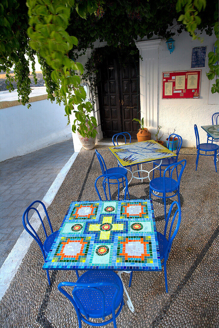 Outdoor cafe with blue tables and chairs, Lindos, Rhodes Island, Greek Islands
