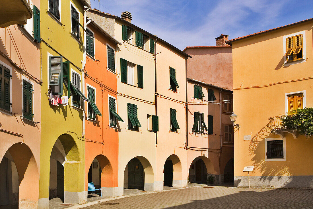Colourful houses on Piazza Fieschi, Varese Ligure, Liguria, Italy