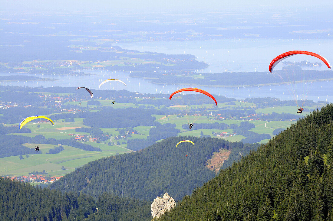 Paragliders at mount Hochries, Chiemgau, Bavaria, Germany