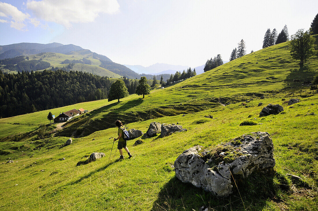 Hiker passing Sudelfeld, near Bayrischzell, Bavaria, Germany