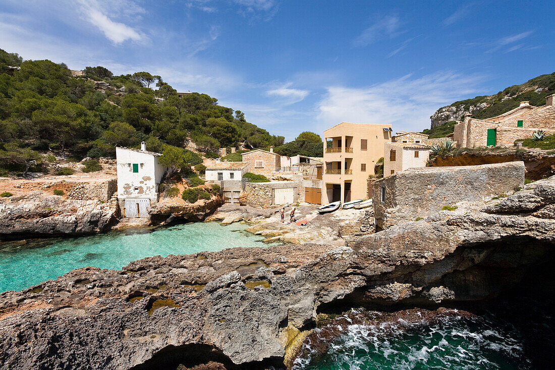 Houses on shore under clouded sky, Cala s'Almonia, Mallorca, Spain, Europe