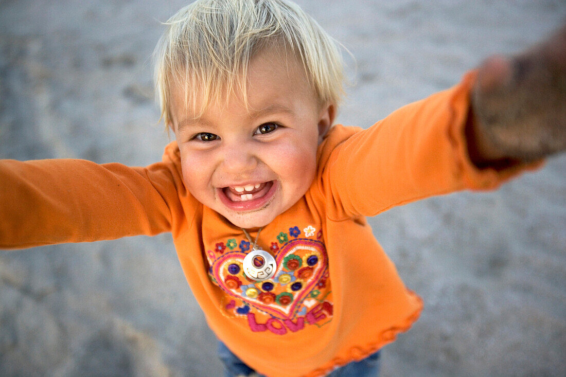 Portrait of a laughing little girl, Punta Conejo, Baja California Sur, Mexico, America