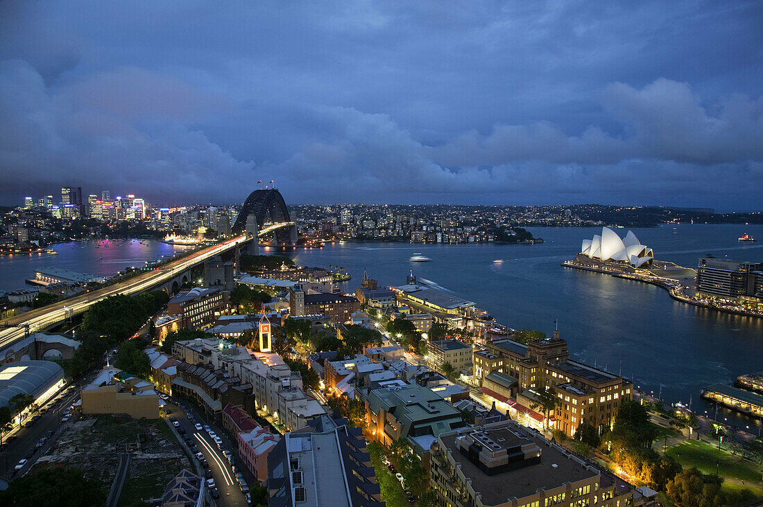 Australia - New South Wales (NSW) - Sydney: Sydney Harbour Bridge and the Sydney Opera House from The Rocks area in the evening
